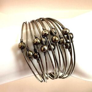 Silver tone multi strand cuff bracelet